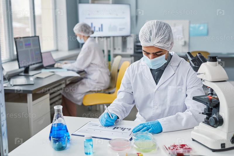 Man working with diagrams at the lab