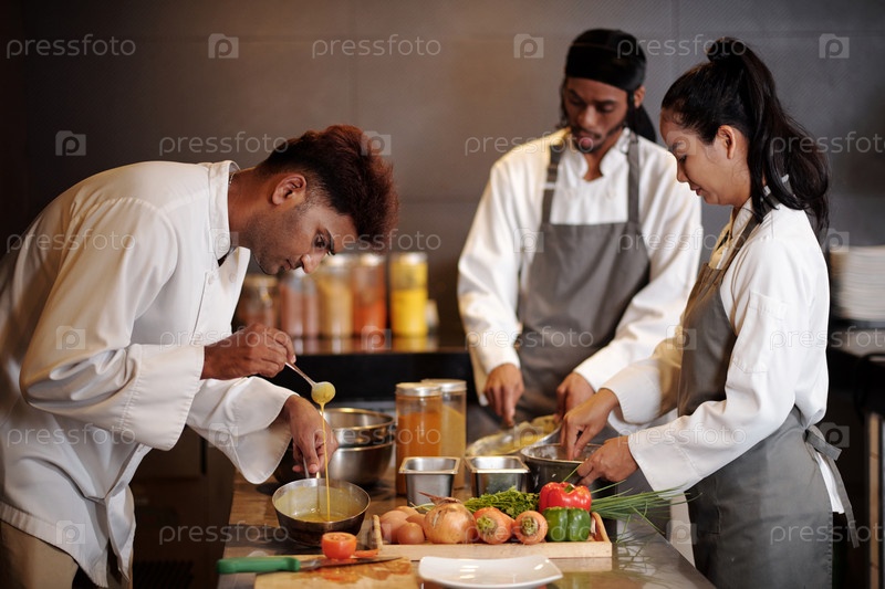 Cooks Working in Kitchen