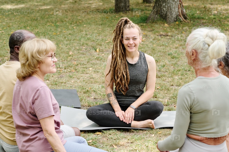 Coach talking to senior people during training