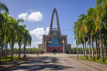 Basilica catedral nuestra señora de la altagracia rising above palm trees in higuey, dominican republic - Pippocarlot