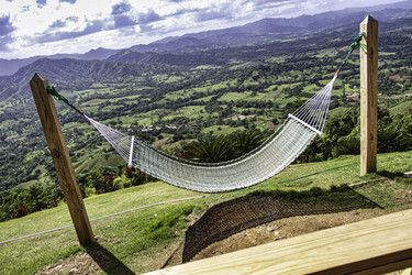 Hammock overlooking lush valley in montaña redonda, dominican republic - Pippocarlot