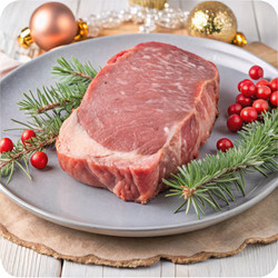 Festive fresh beef steak prepared for New Year’s celebrations and gatherings. Generative AI - RomanZ
