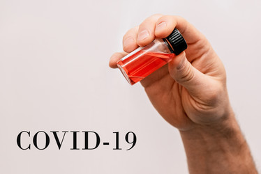 Лаборант держит пробирку, медицинская проблема пандемии вируса COVID-19 - Matroskin