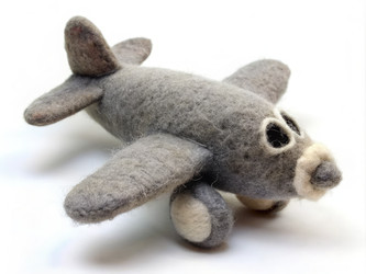 Grey felted aircraft model designed for children’s play and display. Generative AI - RomanZ