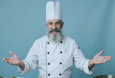 Портрет шеф-повара высшего звена, представляющего концепцию кулинарного обслуживания. - SeventyFour