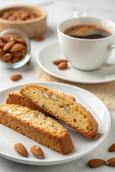 Crunchy Almond Biscotti Cookies Paired With Coffee at a Café. Generative AI - RomanZ