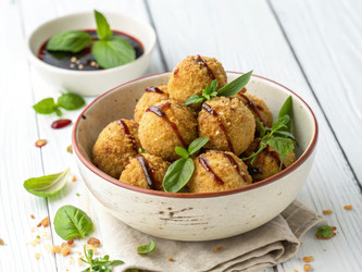 Вкусные жареные шарики из тофу, украшенные листьями базилика. Генеративный искусственный интеллект - RomanZ