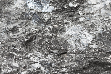 Поверхность необработанной антраксолитовой шунгитовой породы крупным планом - vale