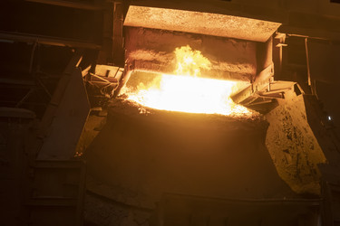 A working open-hearth furnace at a metallurgical plant. Hot steel smeltingНа металлургическом комбинате. Выплавка горячей стали - kostya6969