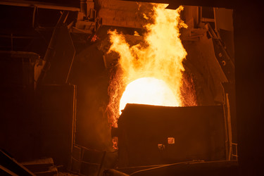 Working open hearth furnace at the metallurgical plant. Molten hot steelНа металлургическом комбинате. Выплавка горячей стали - kostya6969