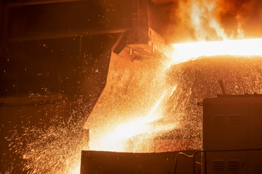 A working open-hearth furnace at a metallurgical plant. Hot steel smeltingНа металлургическом комбинате. Выплавка горячей стали - kostya6969