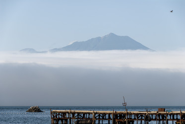 На фоне вулкана Богдан Хмельницкий. Рыбаки. Итуруп. On the background of the volcano Bogdan Khmelnitsky. Fishermen. Iturup. (marka) - marka