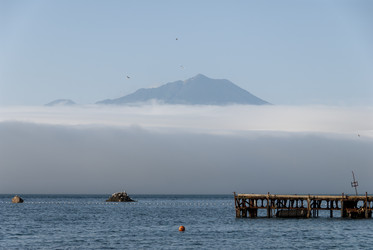 На фоне вулкана Богдан Хмельницкий. Рыбаки. Итуруп. On the background of the volcano Bogdan Khmelnitsky. Fishermen. Iturup. (marka) - marka