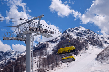 Skazka (Fairy tale) chairlift on the Strela Mountain Park. Roza Khutor ski resort. Sochi. Russia - Serg Zastavkin