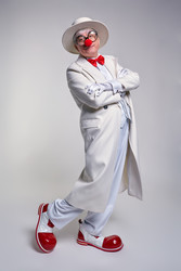 Сlown in a white coat, hat and large red patent leather clown boots. Hands crossed over chest - Serg Zastavkin