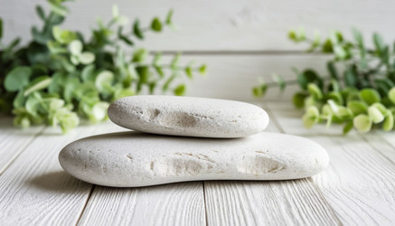 Natural white stone on white wooden table — minimalist monochrome aesthetic for product ads. Clean, organic, and timeless - Nik.Alex
