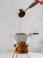 preparing coffee in a pour‑over coffee maker - JuliaLavleis