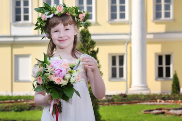 Little beautiful girl in white dress and wreath holds bouquet - paha_l