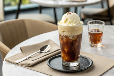 Enjoying a Refreshing Dessert Drink With Ice Cream in a Cozy Café Setting - RomanZ
