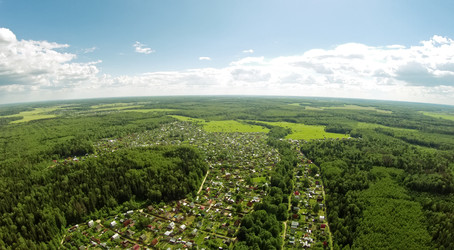 Cottage village among forest at summer sunny day. Aerial view - paha_l
