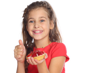 Beautiful girl in a red dress holding a cake with - paha_l