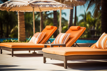 Sunbeds near outdoor swimming pool relax. Vacation relax season poolside. Generate Ai - yliv