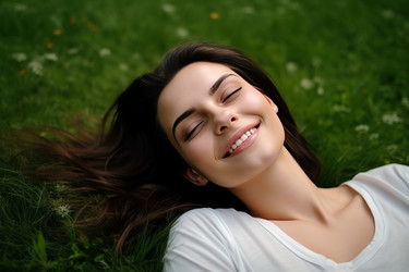 Carefree relaxing brunette on green lawn. Leisure freedom time of young lady in summer nature. Generate ai - yliv