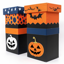 Two halloween gift boxes decorated with pumpkins and bats standing on white background - yliv