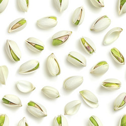 Pistachios pattern forming a healthy and delicious background - yliv