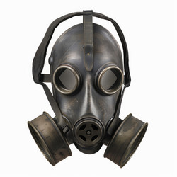 Vintage gas mask isolated on white background representing danger and protection from chemical warfare - yliv