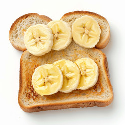 Toasted bread with banana slices and honey forming a delicious breakfast - yliv