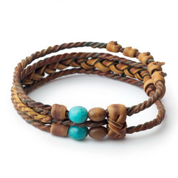 Brown leather bracelet with blue beads isolated on white background - yliv