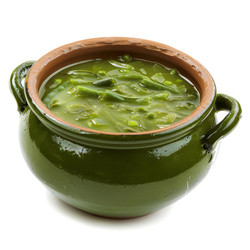Green vegetable soup steaming in a green ceramic tureen - yliv