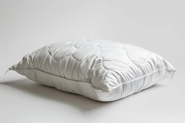 White comfortable orthopedic pillow resting on a white background - yliv