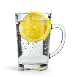 Glass of sparkling water with a lemon slice, providing a refreshing and healthy beverage option - yliv