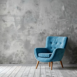 Modern blue armchair standing in empty room with concrete wall and wooden floor - yliv