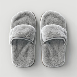 Comfortable grey slippers provide warmth and relaxation on a clean white surface, perfect for a cozy day at home - yliv