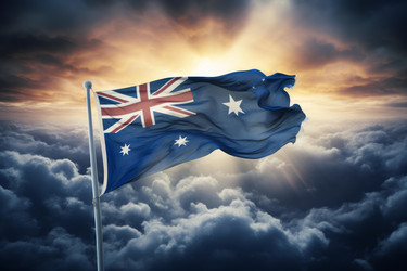 Australian flag waving in cloudy sky at sunset - yliv