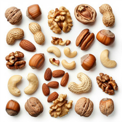 Different types of nuts arranged on a white surface, creating an interesting visual pattern - yliv