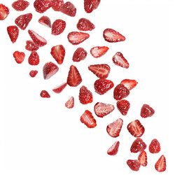 Ripe strawberry pieces falling against a white background, creating a dynamic visual suitable for food and beverage advertising - yliv