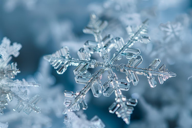 Macro photography showing the perfect hexagonal geometry of a snowflake crystal lying on the snow - yliv