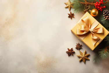 Golden christmas gift box decorated with ribbon and ornaments - yliv
