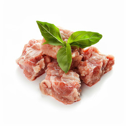 Raw beef cubes seasoned with basil ready for cooking - yliv