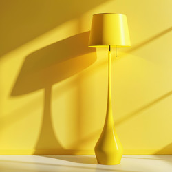 Yellow floor lamp casting a shadow on a yellow wall in a sunlit room - yliv