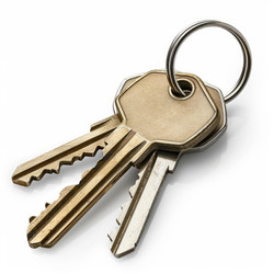 Keys on keyring resting on white background - yliv