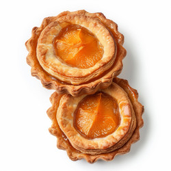 Two delicious apricot pastries showing orange segments on white background - yliv