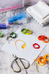 Cross-stitch—a trendy analog hobby—with a kit on the table vertical view - Elena Rui