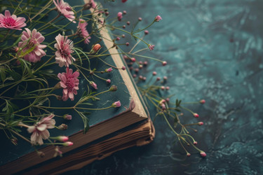 розовые цветы покоятся на антикварной книге на бирюзовом фоне - yliv