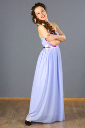 Pretty young woman in blue long dress smiles and - paha_l