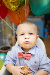 Little boy with smudged face and hands eats - paha_l
